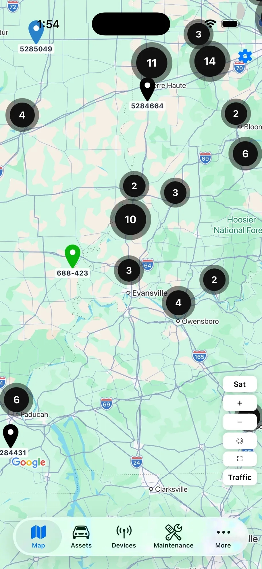 MetraFleet mobile app showing the live fleet map with clustered assets