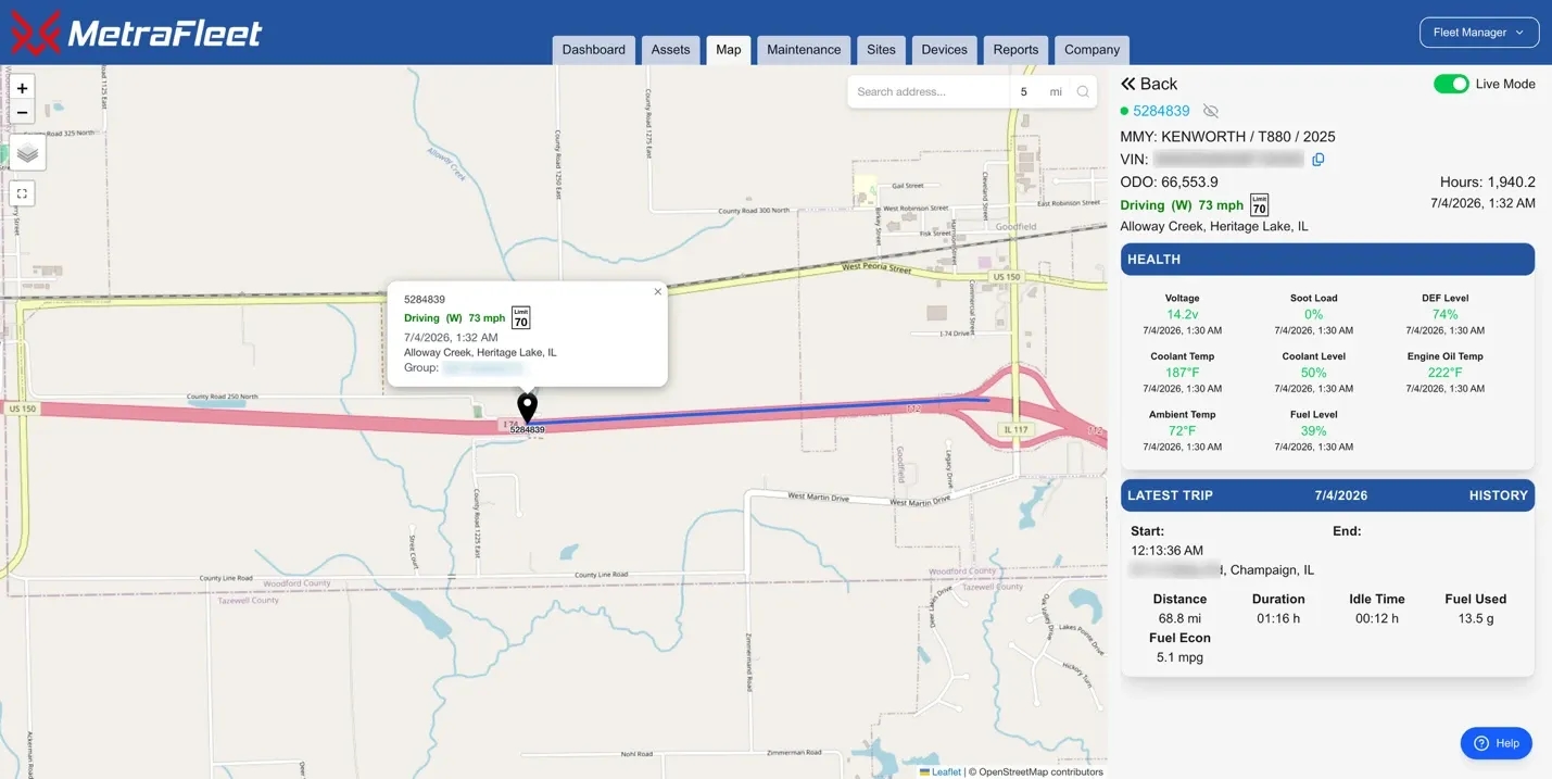 MetraFleet live map with a vehicle selected, showing speed, heading, engine readings and latest trip